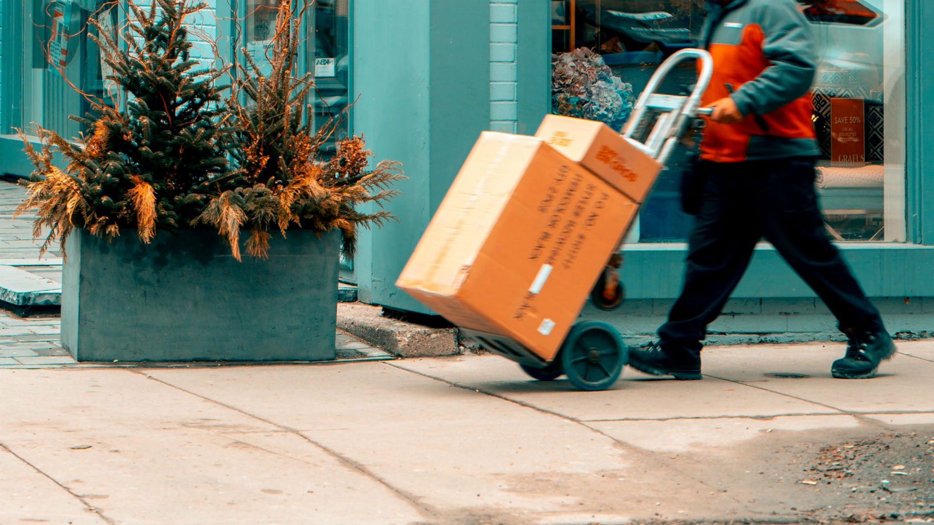 Man pushing handtruck